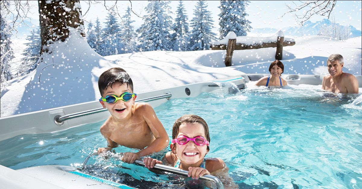 kids in a swim spa in the snow