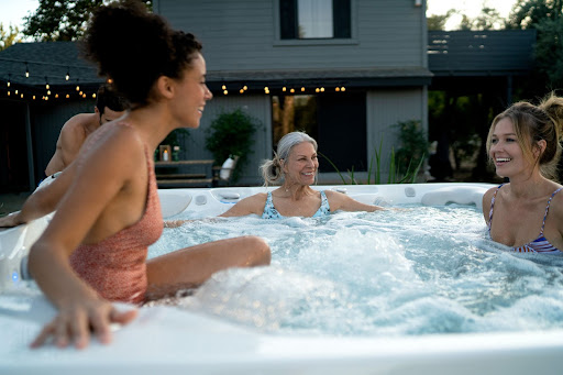 friends who are enjoying how long do people need to stay in a hot tub
