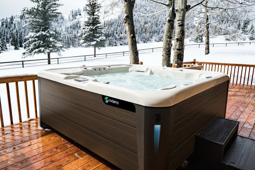 hot tub on a deck in the snow