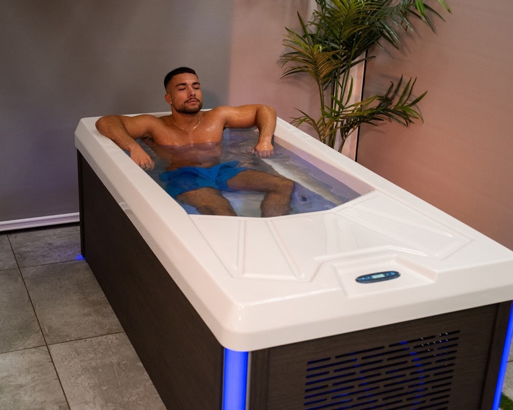 man using cold plunge